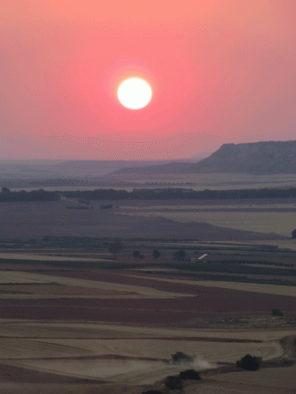 La siega en la Vega a la puesta del sol